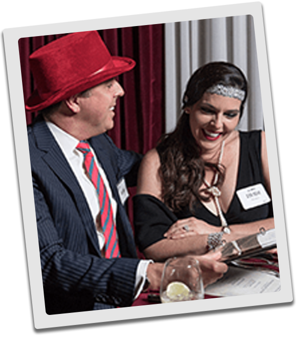 Dallas Murder Mystery couple checking out the dinner menu